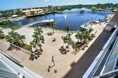 an aerial view of a park with palm trees and water at Laketown Wharf 2115 Penthouse with Gulf Views in PCB - Sleeps 6 in Panama City Beach