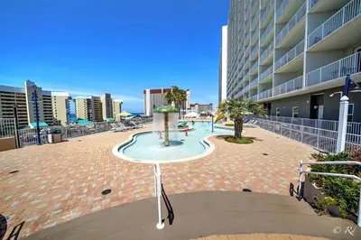 a courtyard with a fountain in the middle of a building at Laketown Wharf 2115 Penthouse with Gulf Views in PCB - Sleeps 6 in Panama City Beach