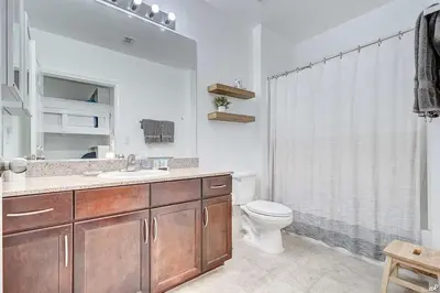 a bathroom with a toilet and a sink and a shower at Laketown Wharf 2115 Penthouse with Gulf Views in PCB - Sleeps 6 in Panama City Beach