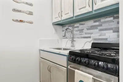 a kitchen with a stove and a sink at Beach Front Ocean View Condo - Top of the Gulf 804 in Panama City Beach