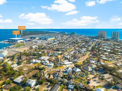 an aerial view of a city and the ocean at Tiny Treasure by Nautical Properties Vacation Rentals in Panama City Beach