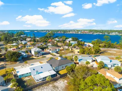 an aerial view of a small town next to the water at Tiny Treasure by Nautical Properties Vacation Rentals in Panama City Beach