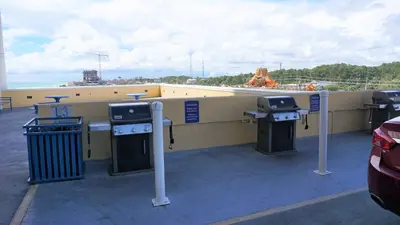 a gas station with a woman in the water at Ocean Front Studio with Epic Gulf Views in Panama City Beach