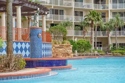 a swimming pool at a resort with a fountain at Shores Of Panama #0924 in Panama City Beach