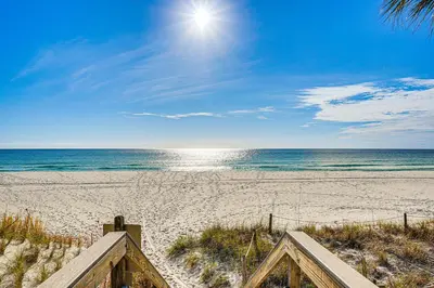 a view of a beach with the sun and the ocean at Walk to Beach PCB Gem with Community Pool Access! in Panama City Beach