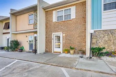 a brick house with a driveway in front of it at Walk to Beach PCB Gem with Community Pool Access! in Panama City Beach