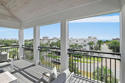 a balcony with a view of the ocean at LegaSea on 30A in Inlet Beach