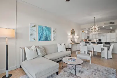 a living room with a couch and a table at Beach Haven in Inlet Beach