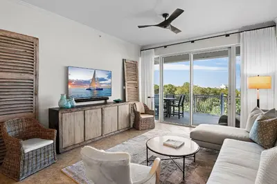 a living room with a couch and a tv at Beach Haven in Inlet Beach