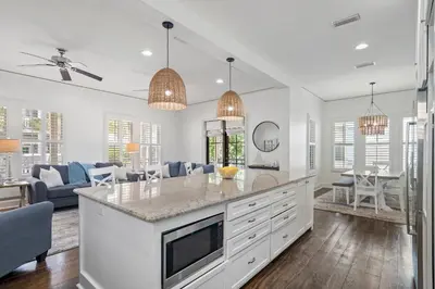 a kitchen with a large island in a living room at Southern Coastal in Inlet Beach