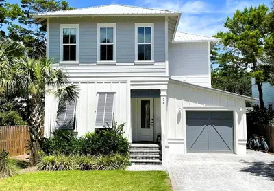 a white house with a garage at 28 Dalton Drive in Santa Rosa Beach