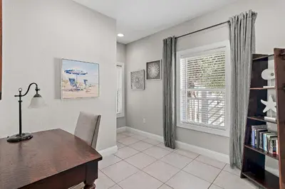 a home office with a desk and a window at Emerald Escape in Santa Rosa Beach