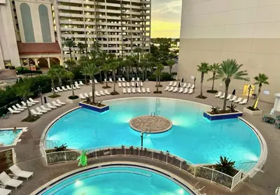 an overhead view of a large swimming pool in a building at Spacious 1-Bedroom! Ocean Views & 5 Pools Resort! by Dolce Vita Getaways PCB in Panama City Beach