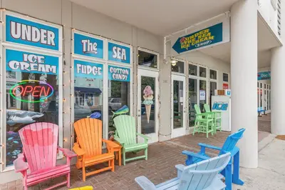 a group of colorful chairs outside of a store at A Winterpast by the Sea - Gulf Front with Private Pool in Santa Rosa Beach
