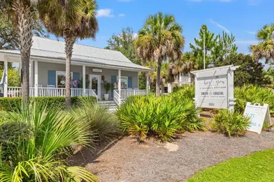 a house with a sign in front of it at A Winterpast by the Sea - Gulf Front with Private Pool in Santa Rosa Beach