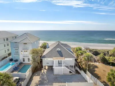 an aerial view of a house and the beach at A Winterpast by the Sea - Gulf Front with Private Pool in Santa Rosa Beach
