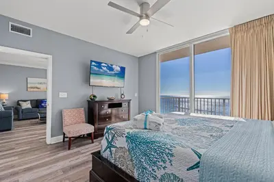 a bedroom with a bed and a view of the ocean at Tidewater Escape: 1BR/2BA beachfront condo, sleeps 6, Gulf views & comfort! in Panama City Beach