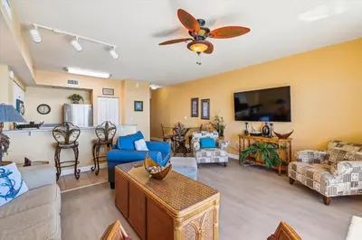 a living room filled with furniture and a flat screen tv at Shores of Panama 2302 condo in Panama City Beach