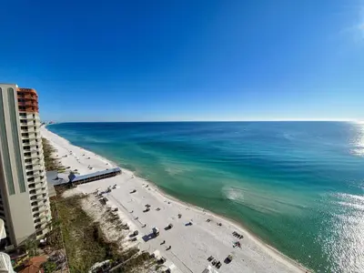 an aerial view of a beach with people and the ocean at Shores of Panama 1601 condo in Panama City Beach