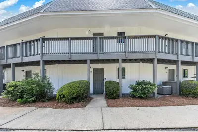a house with a balcony on top of it at Hidden Beach Villas 122 - A Sunset Paradise in Santa Rosa Beach