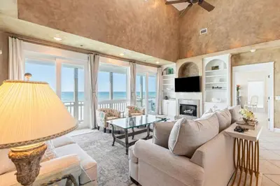 a living room with a couch and a table at Beachfront, 4 Bed , White Sands Haven, Penthouse ,Pool in Panama City Beach