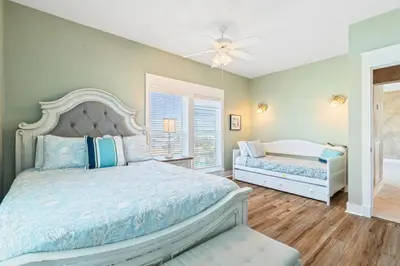 a bedroom with two beds and a ceiling fan at Beachfront, 4 Bed , White Sands Haven, Penthouse ,Pool in Panama City Beach