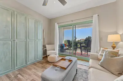 a living room with a couch and a table at Inn at Seacrest 309- Somewhere in the Sun in Inlet Beach