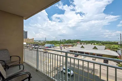 a balcony with a view of a parking lot at Aqua 0411 in Panama City Beach