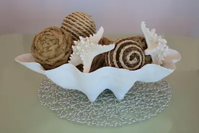 a plate with two seashells on a table at Aqua 0504 in Panama City Beach