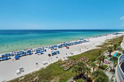 an aerial view of a beach with umbrellas at Aqua 0602 in Panama City Beach