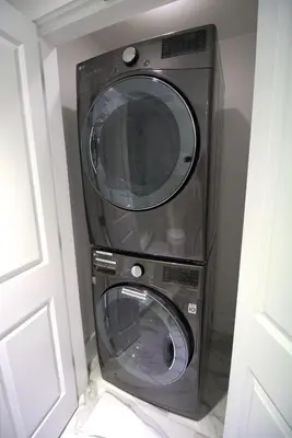 a washer and dryer in a corner of a room at Aqua 1802 in Panama City Beach