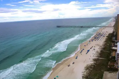 an aerial view of a beach with a pier at Aqua 2305 in Panama City Beach