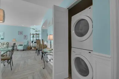 a laundry room with two washer and dryer at Aqua 1711 in Panama City Beach