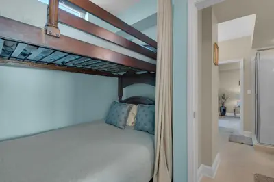 a bedroom with a bunk bed in a room at Aqua 1711 in Panama City Beach