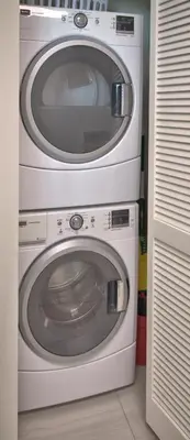 two washing machines stacked on top of each other at Aqua 1502 in Panama City Beach
