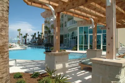 a resort with a swimming pool and a building at Aqua 1502 in Panama City Beach