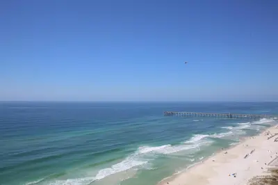 an aerial view of a beach with a pier at Aqua 1502 in Panama City Beach