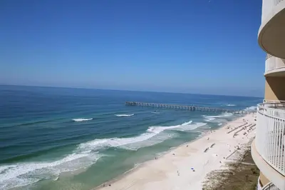 a view of a beach with people and a pier at Aqua 1502 in Panama City Beach