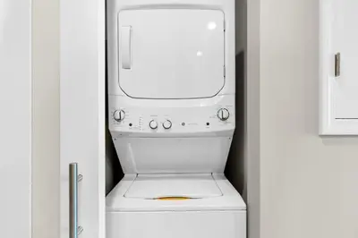 a white washer and dryer in a kitchen at Aqua 2308 in Panama City Beach