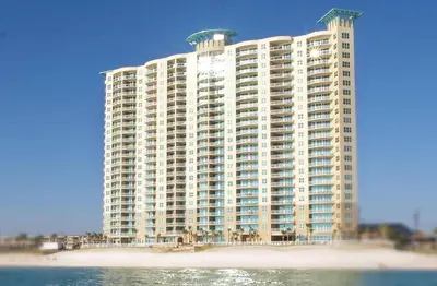 a large building on the beach next to the water at Aqua 2308 in Panama City Beach