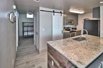 a kitchen with a sink and a counter top at Aqua 2111 in Panama City Beach