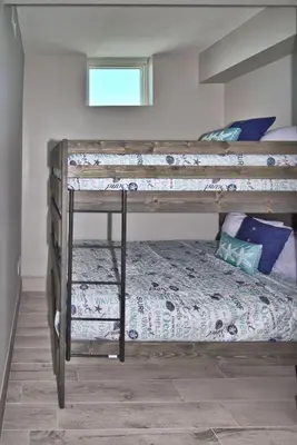 a bedroom with two bunk beds and a bed at Aqua 2111 in Panama City Beach