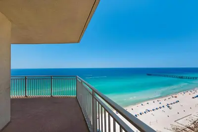 a balcony with a view of the beach and the ocean at Aqua 2111 in Panama City Beach