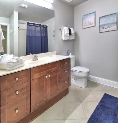 a bathroom with a sink and a toilet at Aqua 1507 in Panama City Beach