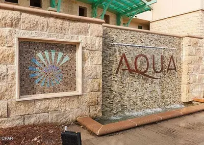 aania sign on the side of a building at Aqua 1507 in Panama City Beach