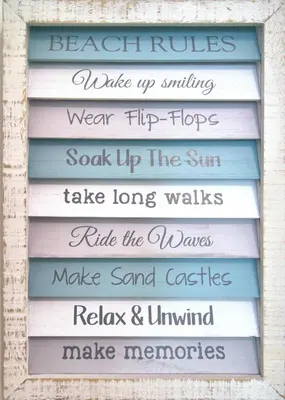 a sign for the beach rules wake up surfing wear flip flops soak up at Aqua 0506 in Panama City Beach