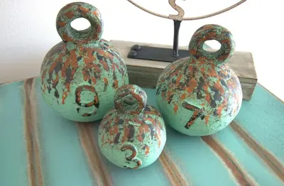 a group of vases sitting on top of a table at Aqua 0506 in Panama City Beach