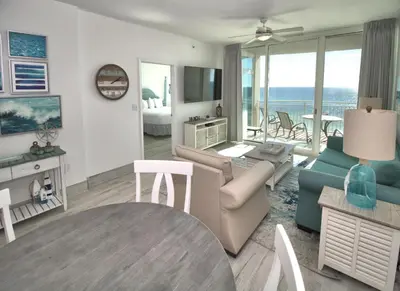a living room with a couch and a table at Aqua 0506 in Panama City Beach