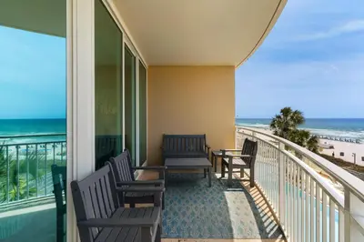 a balcony with chairs and a view of the beach at Aqua 0210 in Panama City Beach