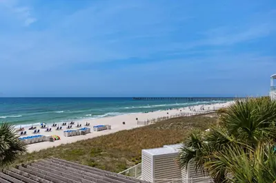a view of the beach from the balcony of a resort at Aqua 0210 in Panama City Beach